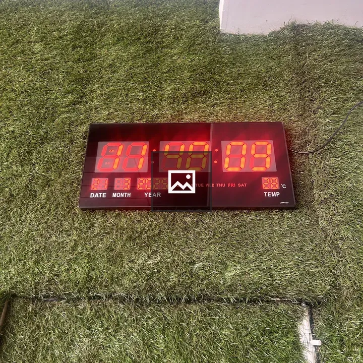 Digital clock on artificial grass