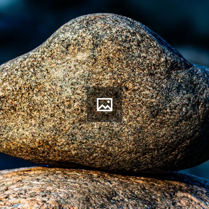 Granite rock balanced on stone