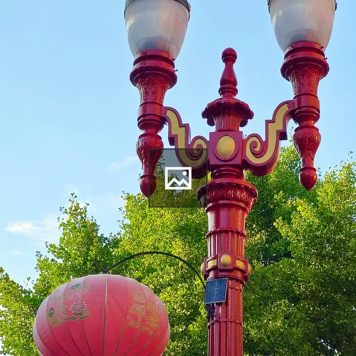 Decorative lamp post with red lantern