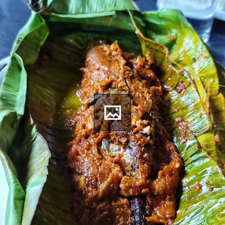 Fried fish in batter on banana leaf