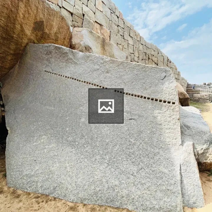 Stone with multiple dots in Hampi ruins
