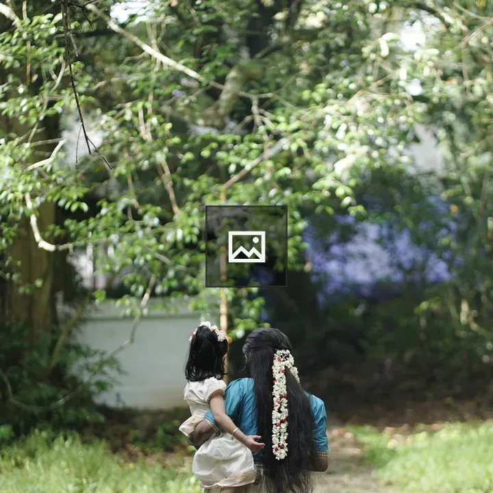 A woman walking with her child