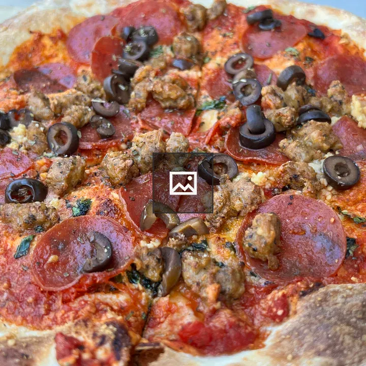 Pizza with pepperoni and olives