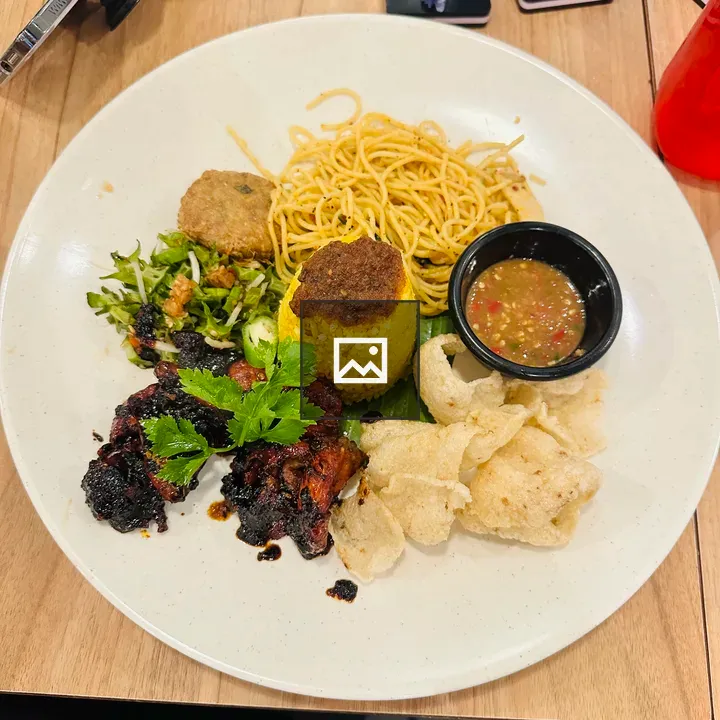 Plate of yellow rice and noodles