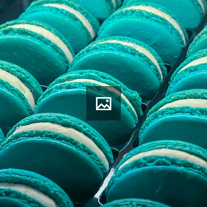 Three rows of teal macarons