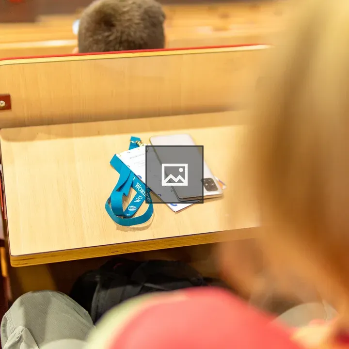 Conference hall desk with WordPress badge