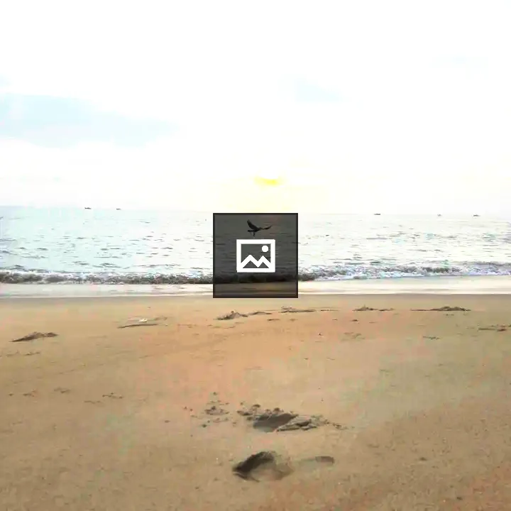 Serene beach scene with footprints