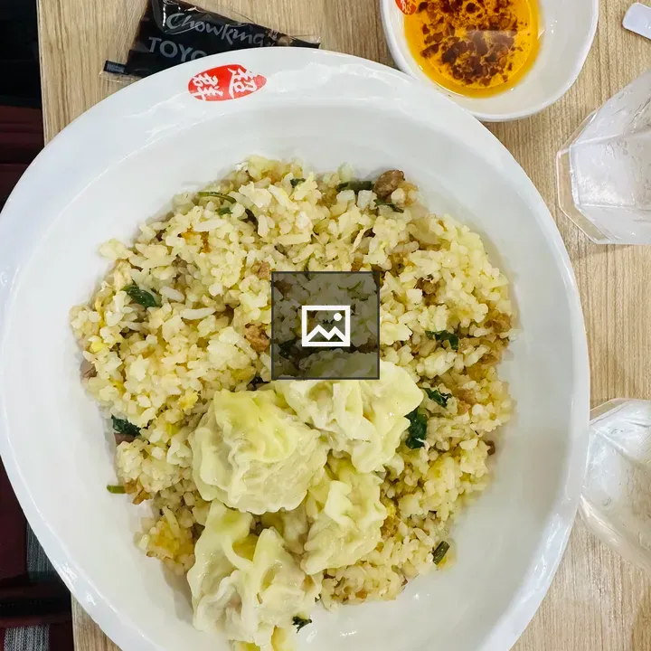 Bowl of fried rice and dumplings