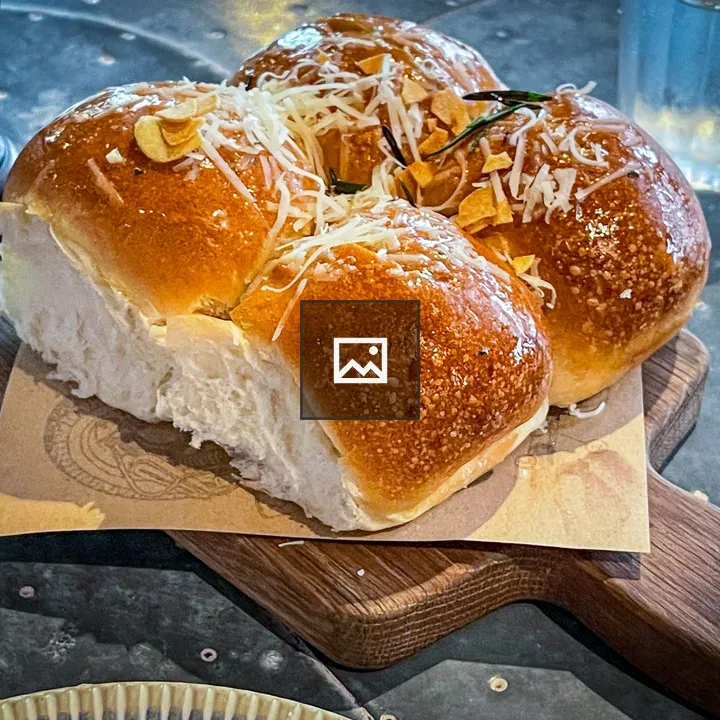 Dinner rolls on wooden board