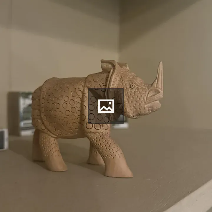 Rhino sculpture on shelf