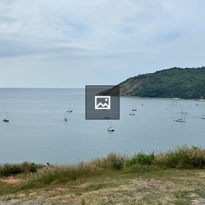 Coastal boats at calm sea