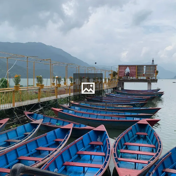 Blue Wooden Boat on Lake