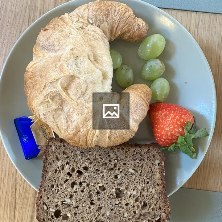 Bread, Butter and Fruit on Plate