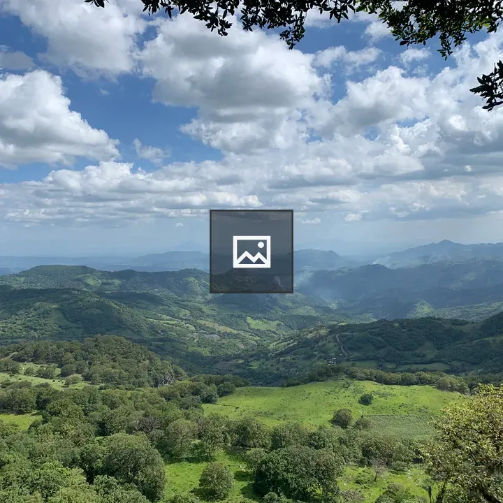 Landscape of Green Hills and Mountains