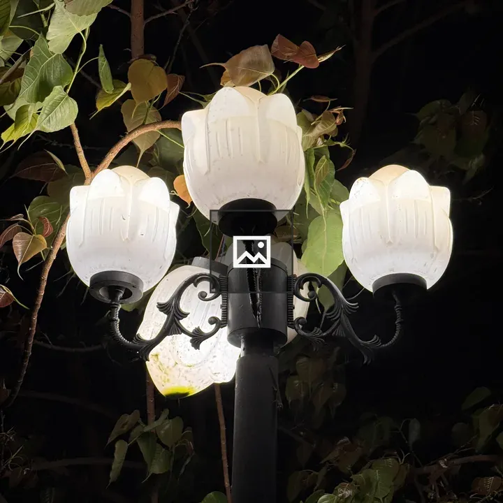 Three-flament street lamp at night