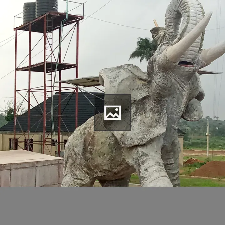 Elephant sculpture with scaffolding backdrop