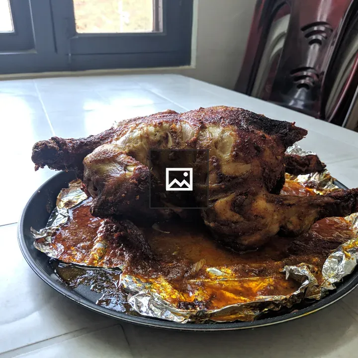 Roast chicken on foil and tray