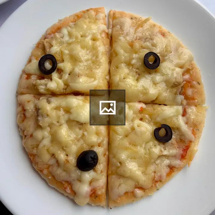 Mini pizza on white plate