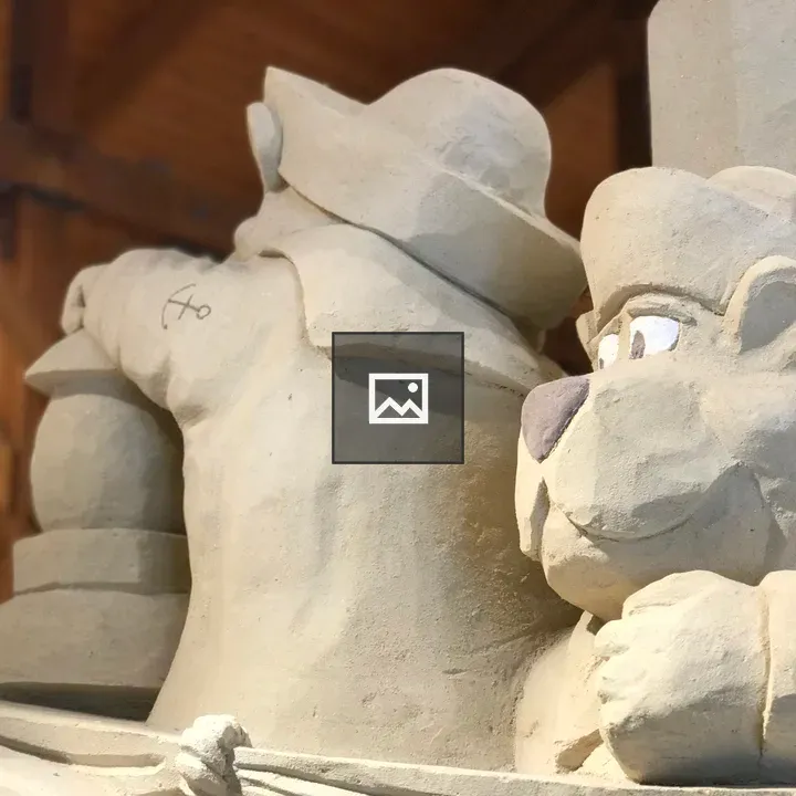 Sand sculpture bears on a boat