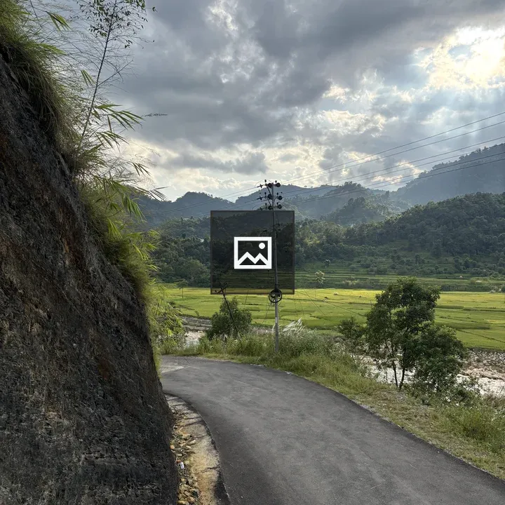 Winding Road Along Rocky Hillside