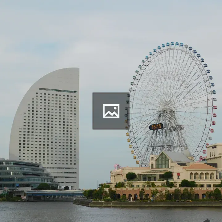 Curved building and Ferris wheel in Yokohama