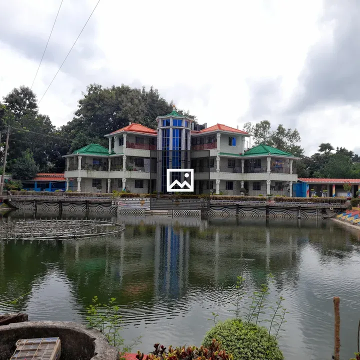Colorful building reflected in pond