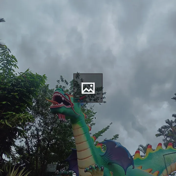 Dragon sculpture among greenery