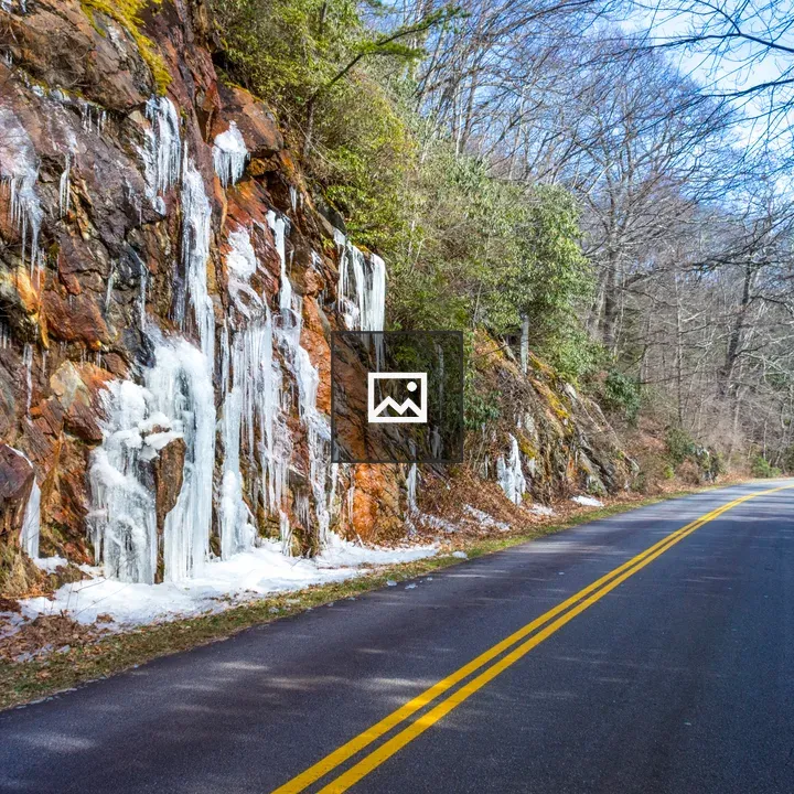 Icy water runoff along road