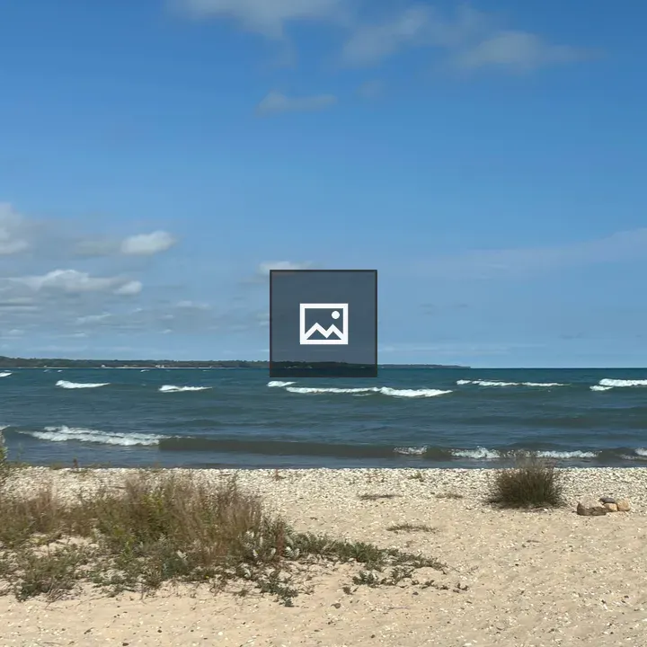 Beach scene with person walking