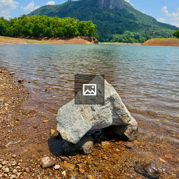 Rock in calm Kanjirapuzha water