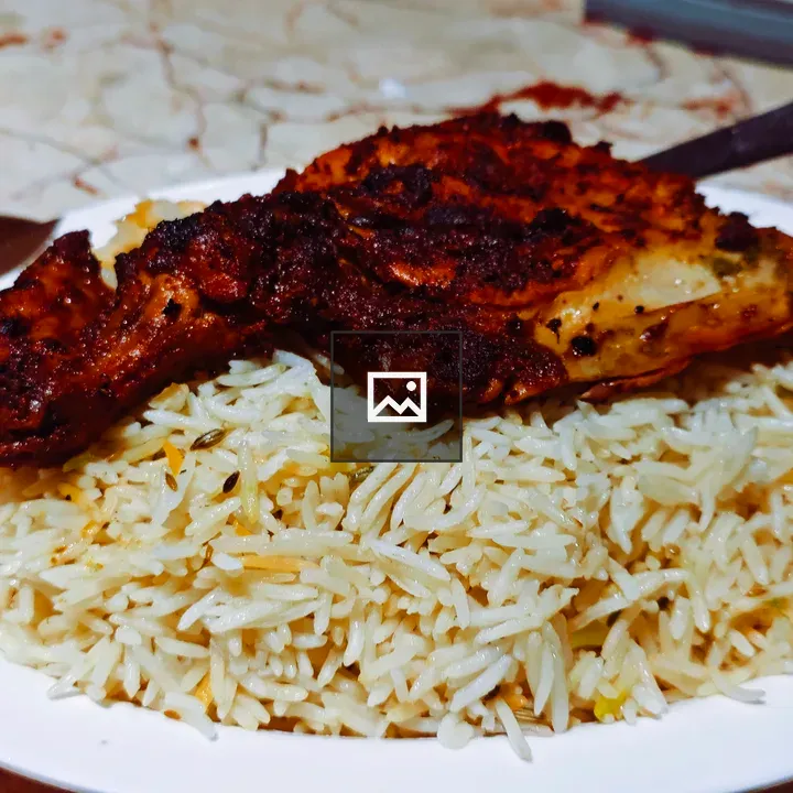 Plate of plain rice with char-grilled chicken