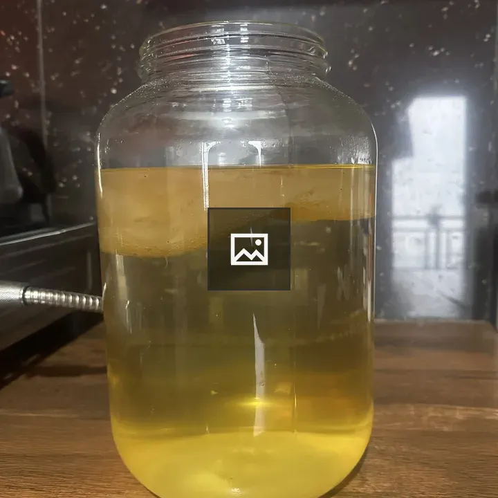 Glass Jar with Yellow Liquid