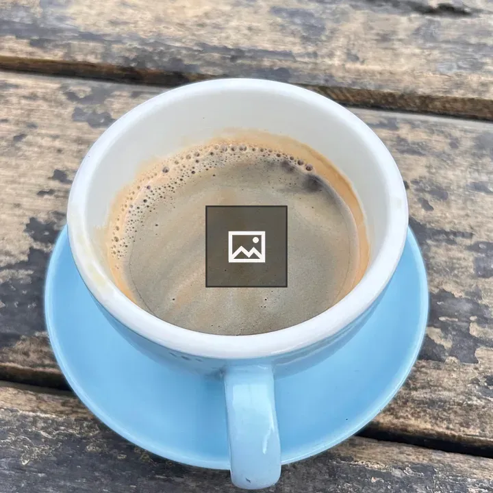 Cup of Coffee on Light Blue Saucer