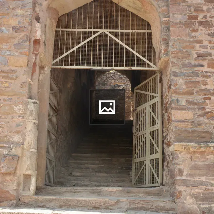 Steep stone staircase at archway
