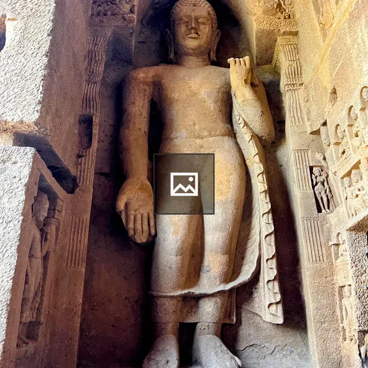 Buddha statue in rocky niche