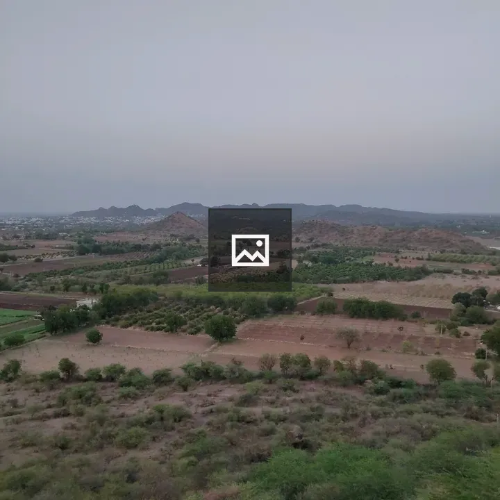 Vista of Fields with Distant Buildings