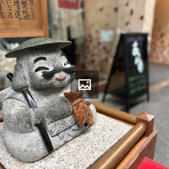 Ebisu statue detail in arcade