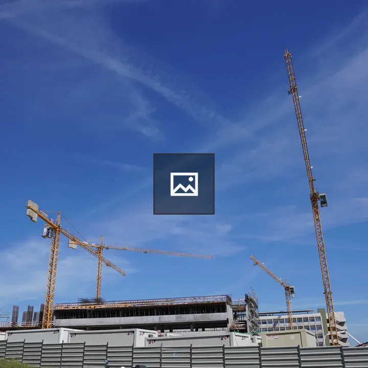 Construction site with yellow cranes
