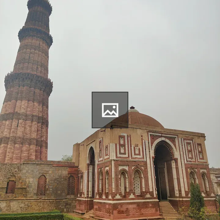 Tall minaret and ornate domed structure