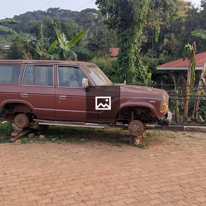 Abandoned brown SUV on blocks