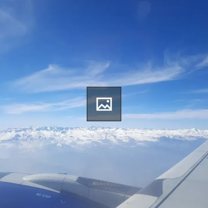 Snowy mountains from airplane window