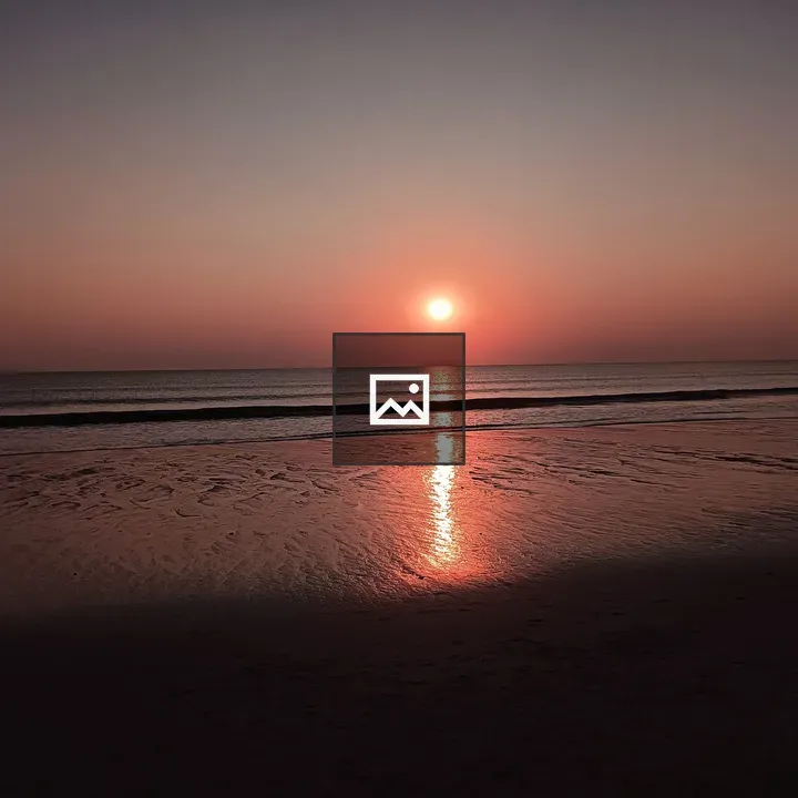 Beach Sunset Over Wet Sand