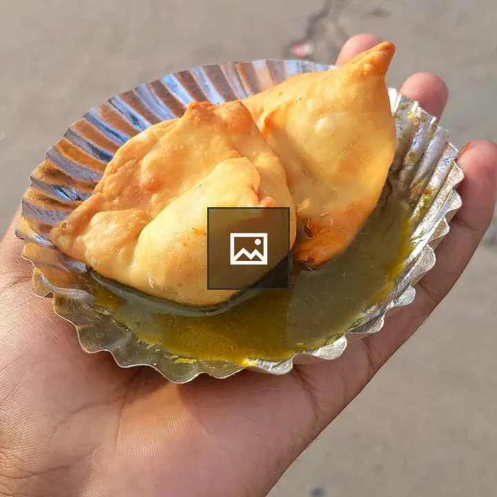 Two mini samosas on plate