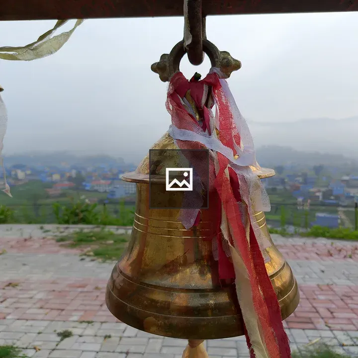 Brass bell with ribbons