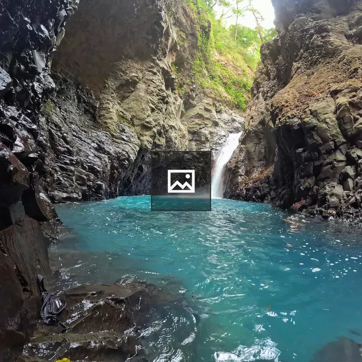Waterfall into Turquoise Pool