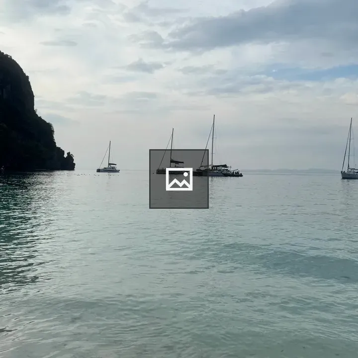 Sailing yachts on calm tropical water