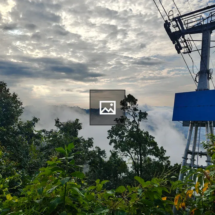 Misty mountains with cable car