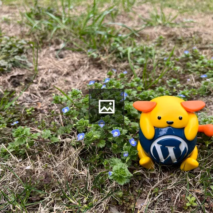 Wapuu and Blue Flowers