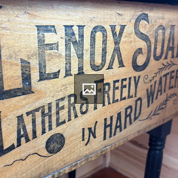 Antique wooden box with ad