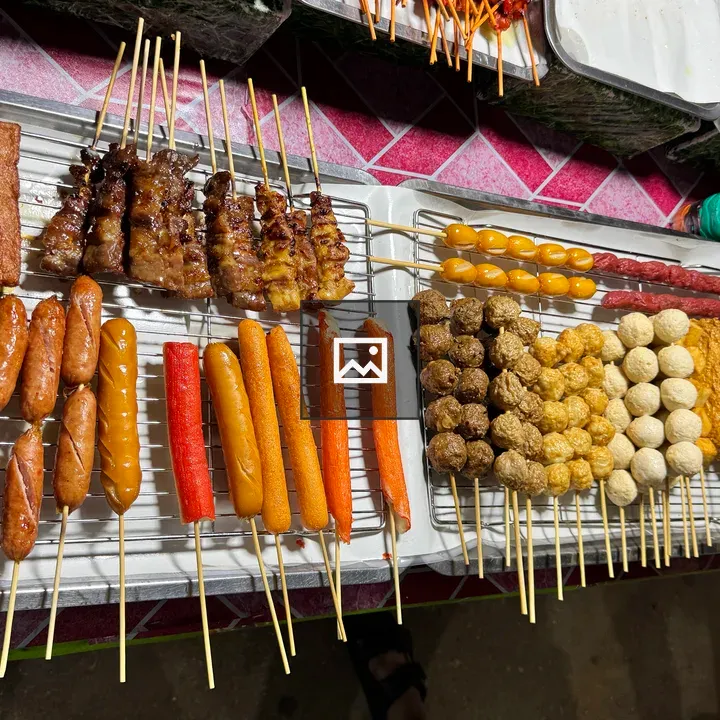 Street food skewers on rack